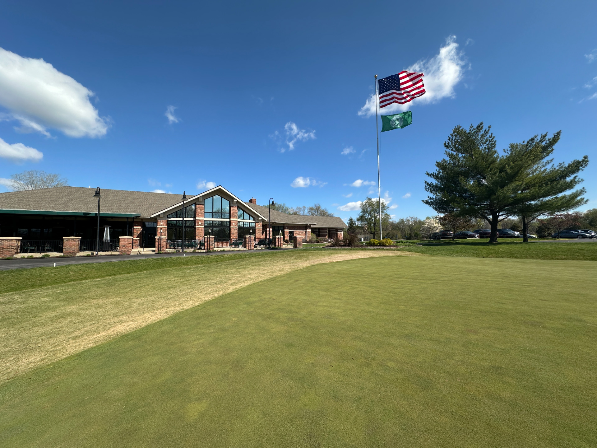 Golf-clubhouse-putting-green-flags-sunny-day-St_-Clair-Country-Club